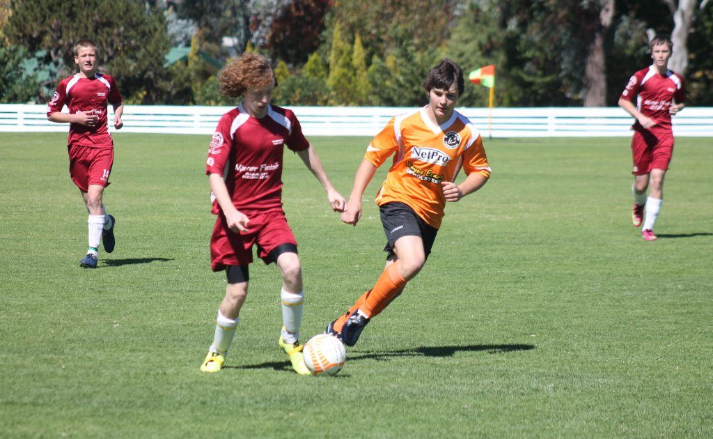 Senior Colts Warwick player Daniel King is pursued by City opponent Jacob Marsh. Senior Colts Warwick player Daniel King is pursued by City opponent Jacob Marsh.